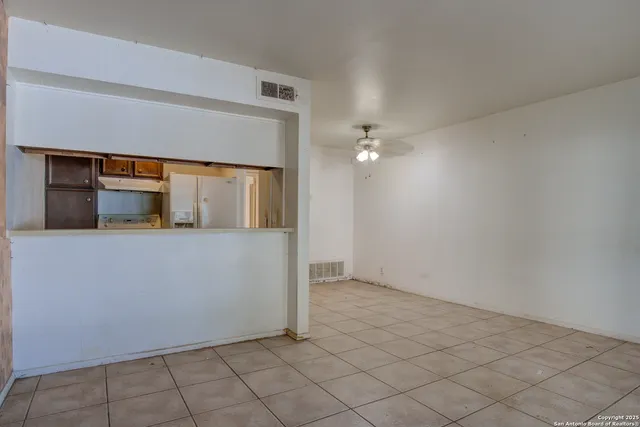 a view of an empty room and window