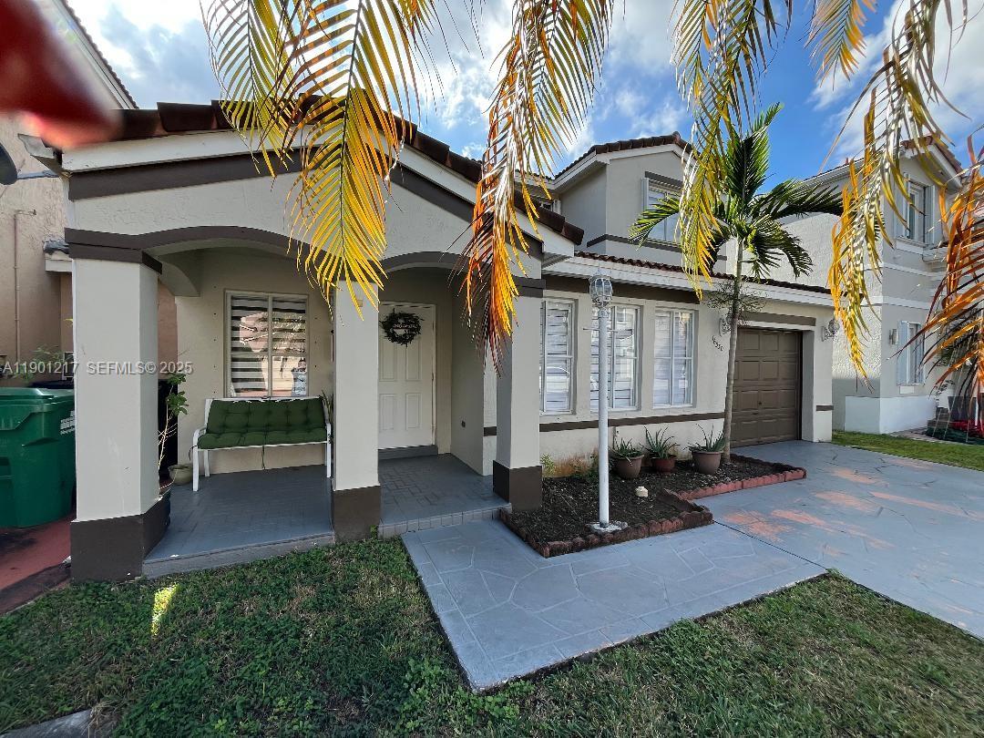 16530 Southwest 96th Terrace Miami, FL 33196 - Photo 1 of 22 a view of a house with a patio