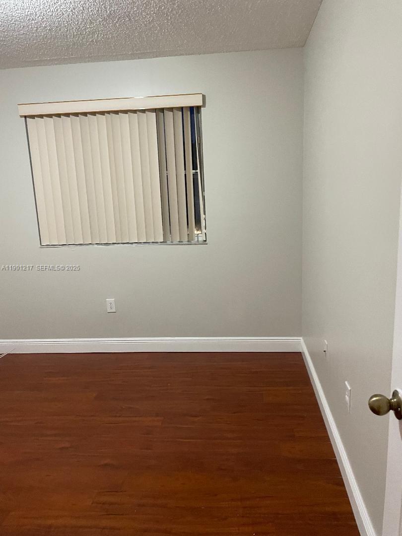 16530 Southwest 96th Terrace Miami, FL 33196 - Photo 13 of 22 a view of wooden floor in a room