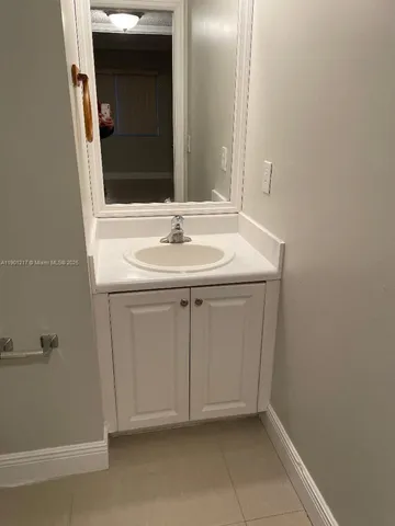 a view of yard with porch and wooden fence