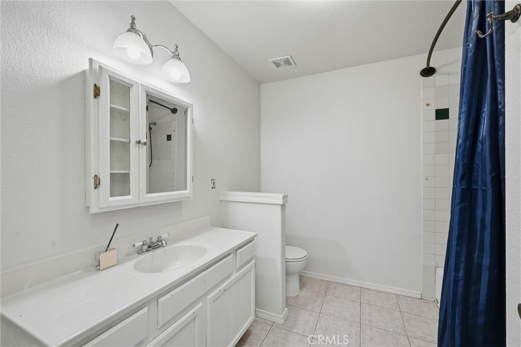 16211 Golf Middletown, CA 95426 - Photo 15 of 29 Common bathroom up stairs w/linen closet