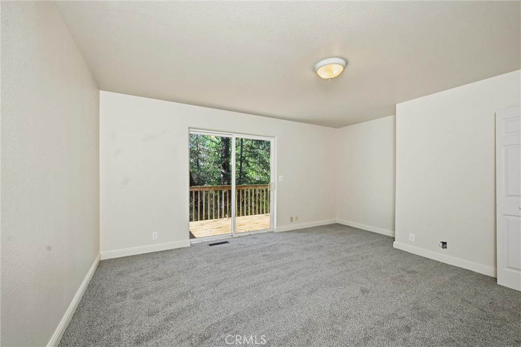 16211 Golf Middletown, CA 95426 - Photo 21 of 29 Den/playroom/hobbie room on third level with deck outside