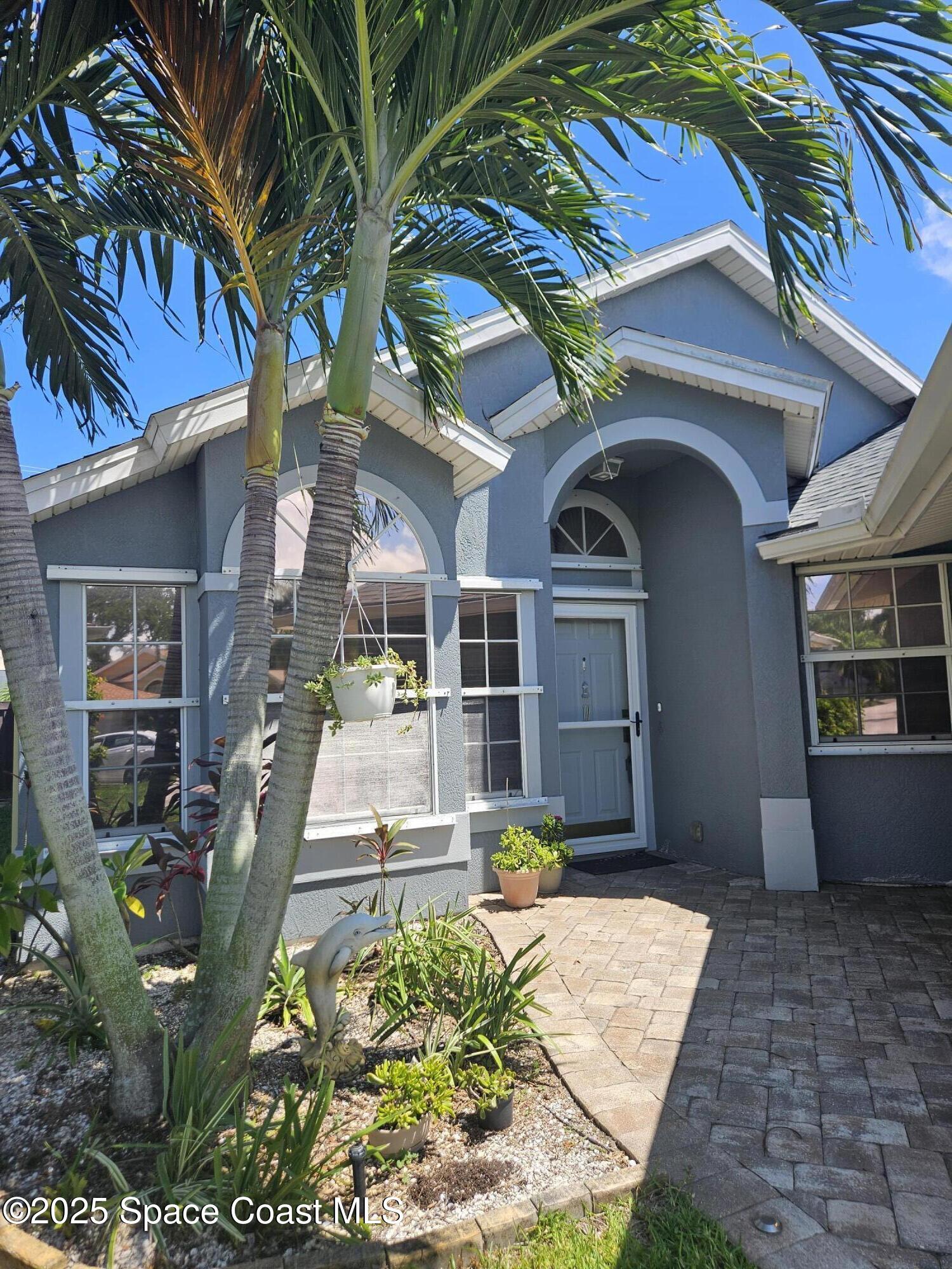 3904 St Armens Circle Melbourne, FL 32934 - Photo 3 of 38 a front view of a house with a yard