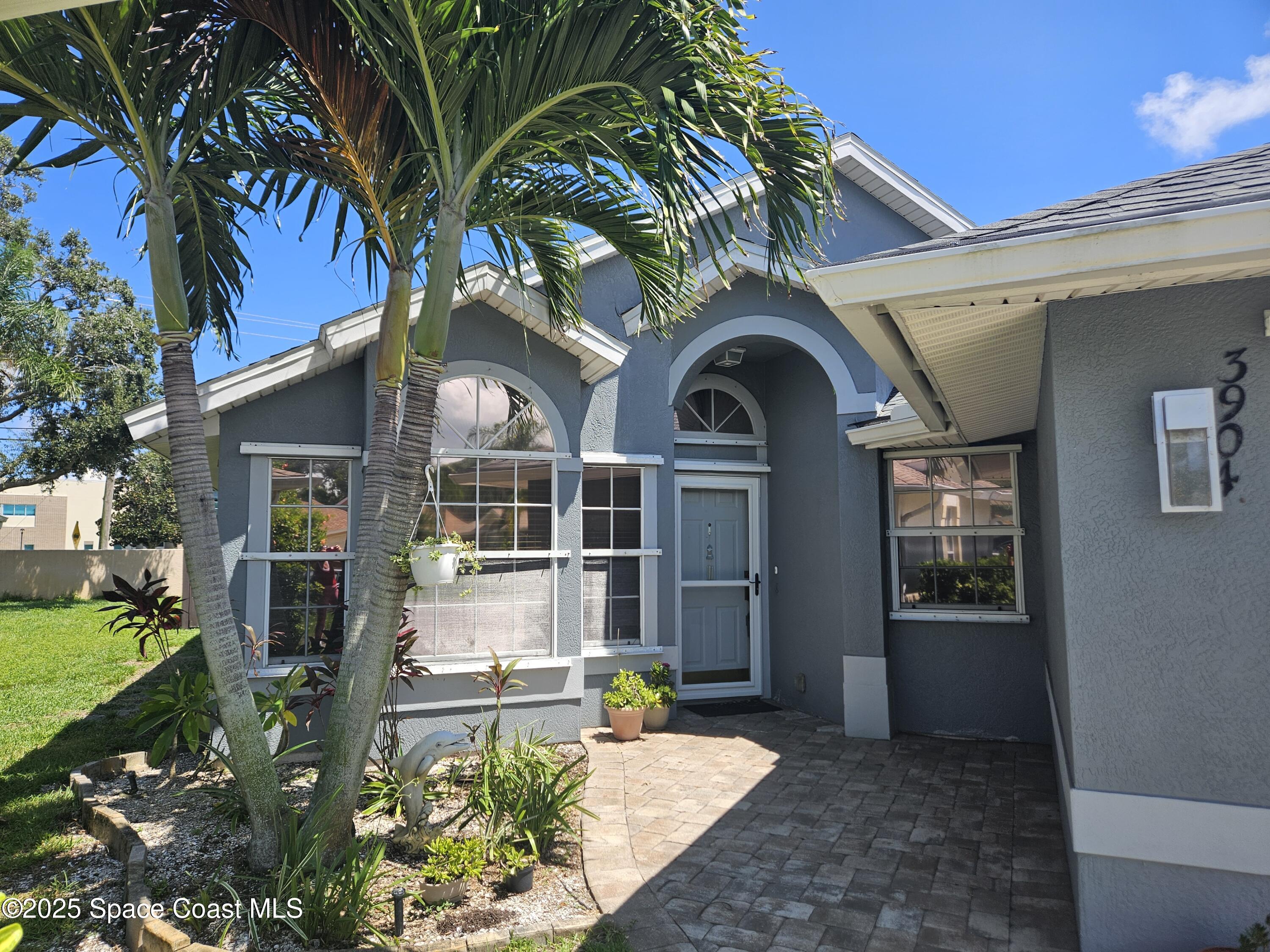 3904 St Armens Circle Melbourne, FL 32934 - Photo 32 of 38 a front view of a house with garden