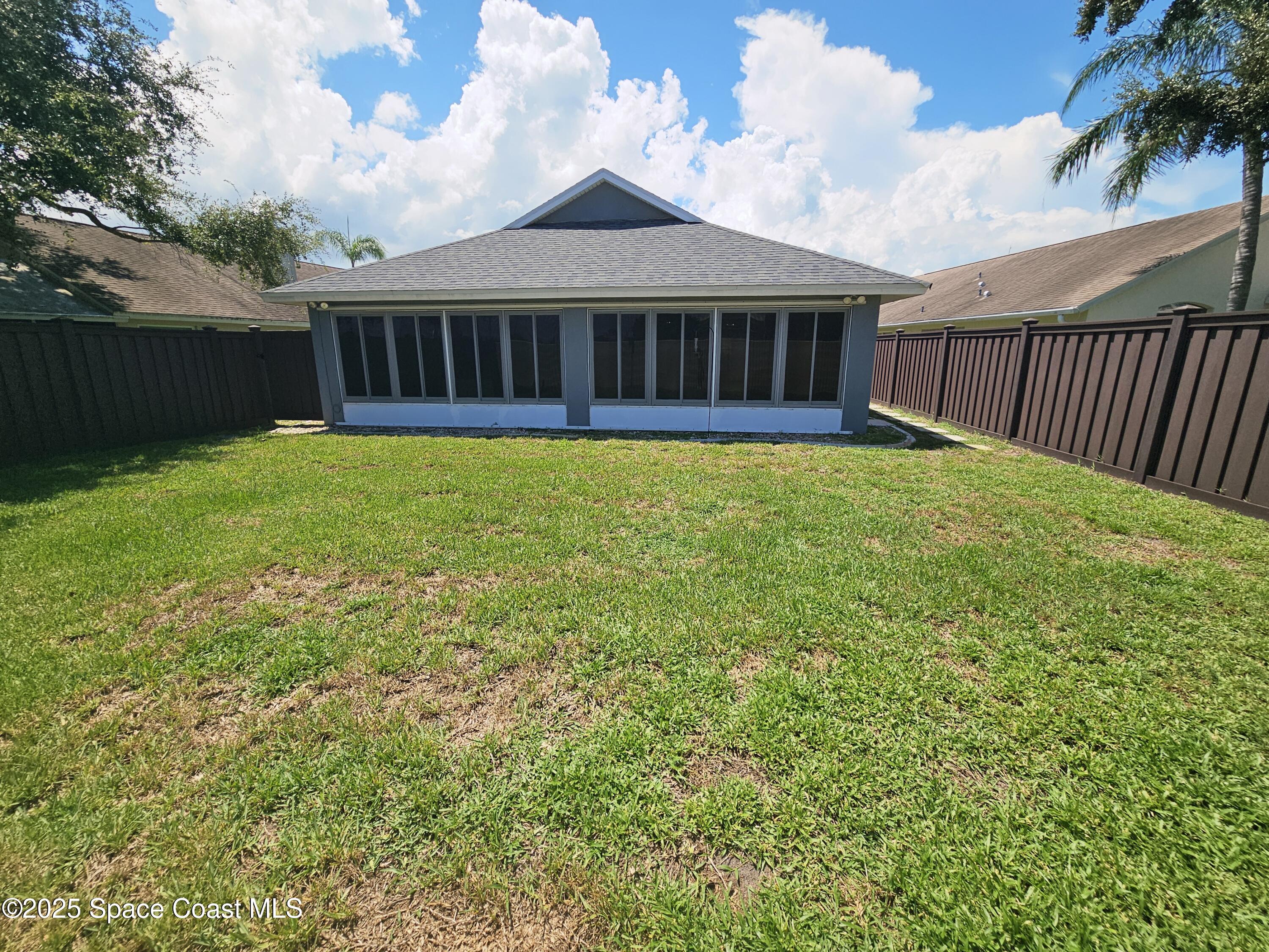 3904 St Armens Circle Melbourne, FL 32934 - Photo 35 of 38 a view of a house with a yard