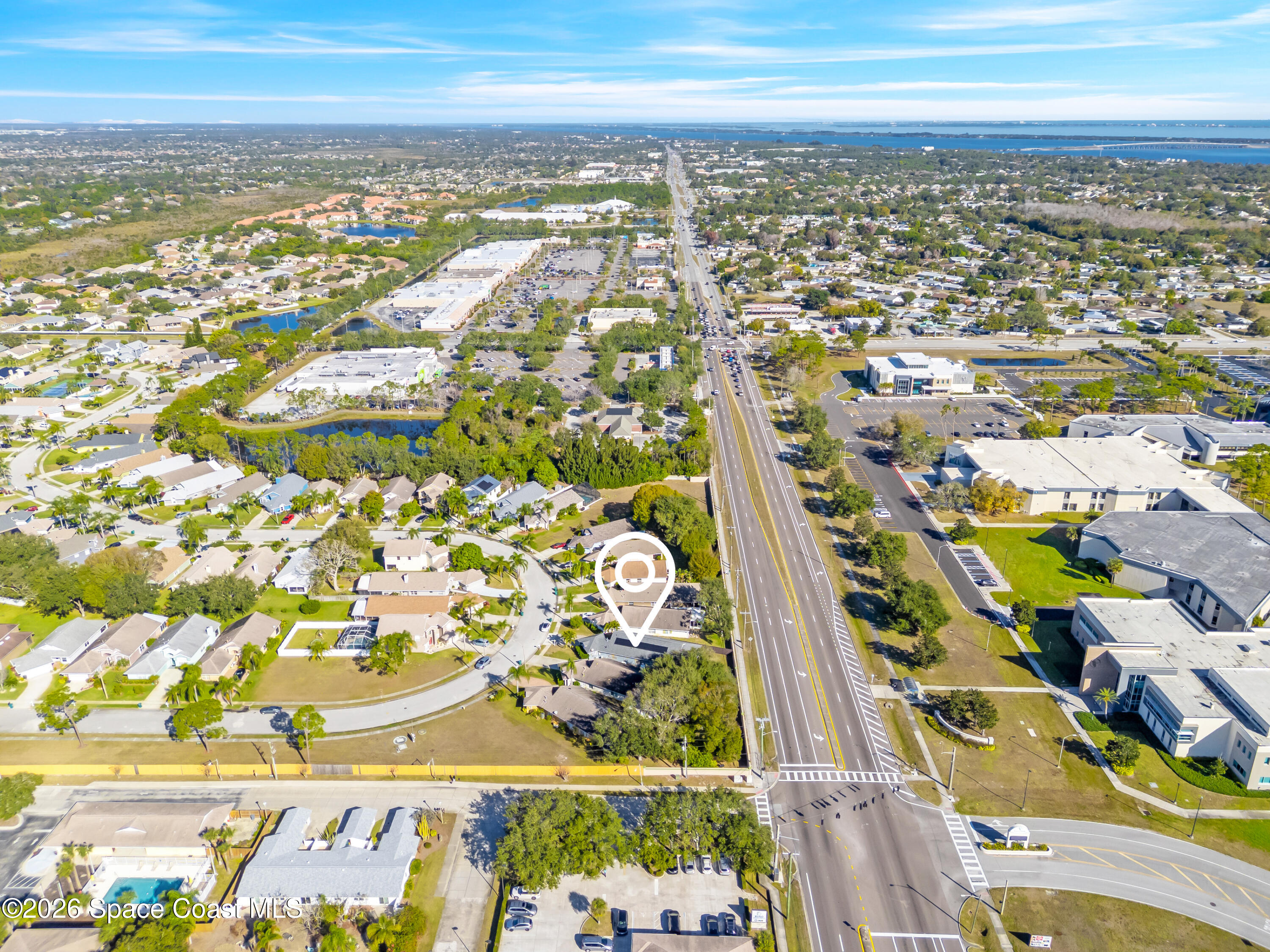 3904 St Armens Circle Melbourne, FL 32934 - Photo 9 of 38 an aerial view of residential building and parking space