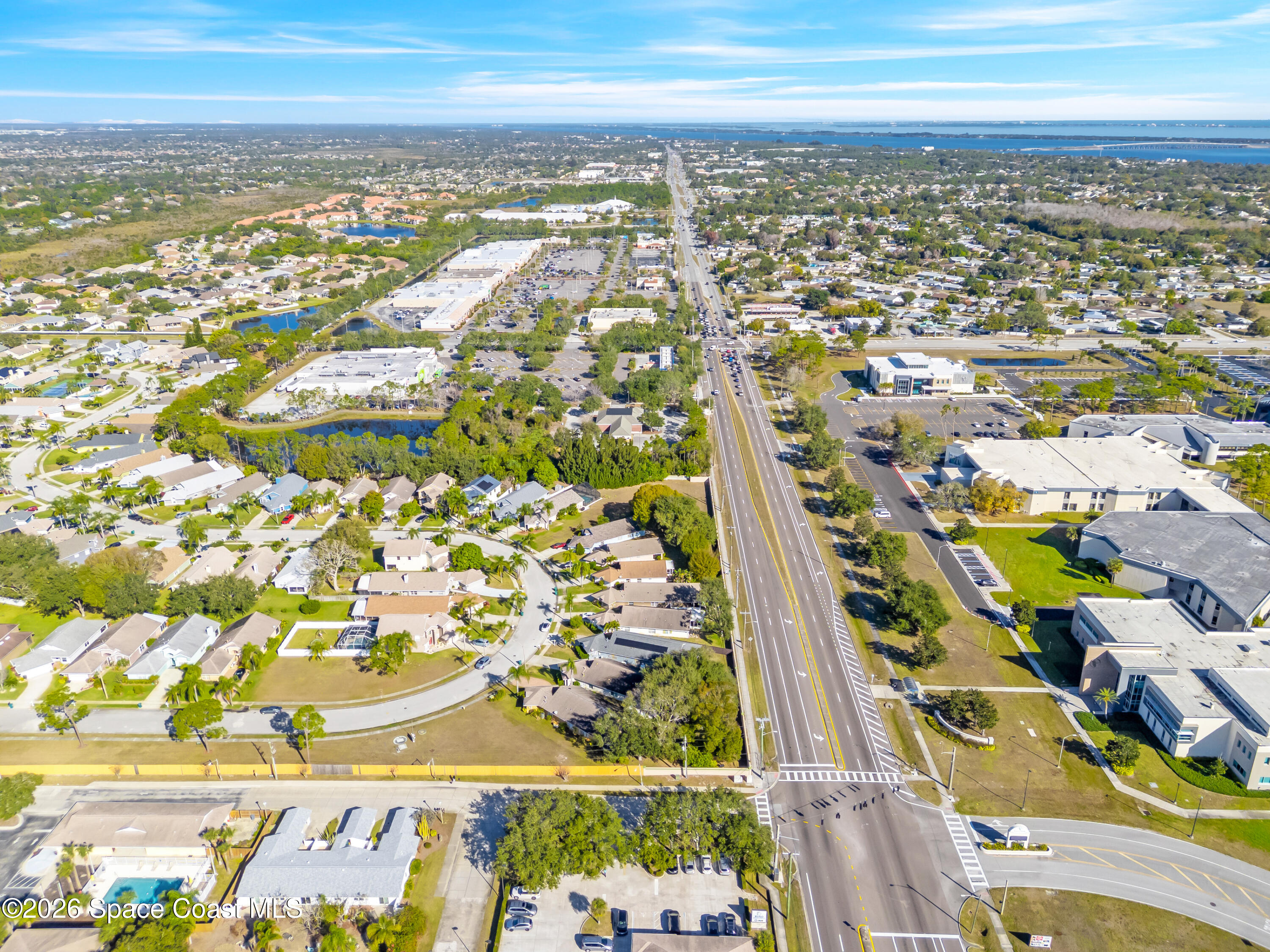 3904 St Armens Circle Melbourne, FL 32934 - Photo 10 of 38 an aerial view of residential building and parking space