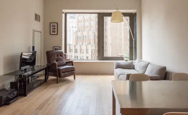 a living room with furniture and a window