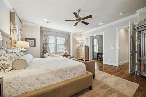 a view of a bedroom with furniture and window