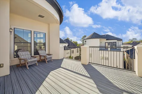 a view of a chairs and table in a backyard
