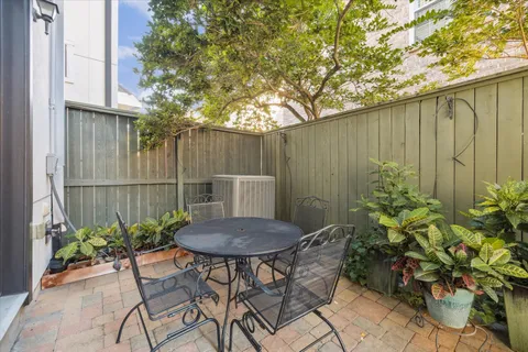 a view of balcony with furniture and a potted plant