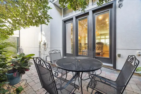 a view of a backyard with potted plants