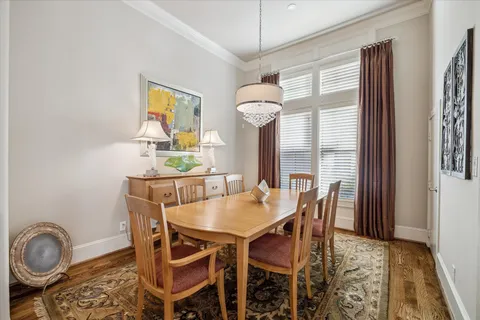 a kitchen with stainless steel appliances granite countertop lots of counter top space and wooden floor