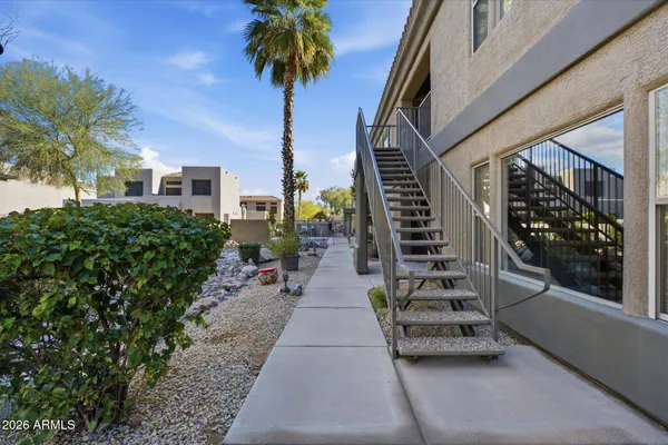 a view of a pathway with a house