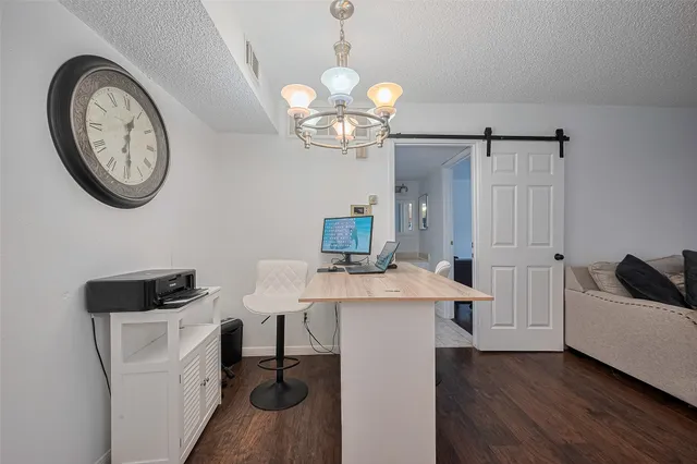 a view of a kitchen with an oven and a refrigerator