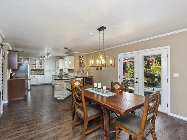 1528 Reche Road Fallbrook, CA 92028 - Photo 15 of 32 a view of a dining room with furniture window and wooden floor