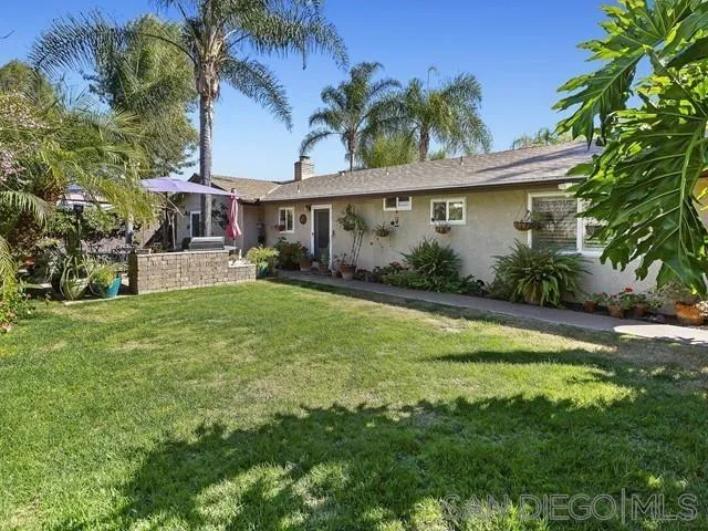 1528 Reche Road Fallbrook, CA 92028 - Photo 25 of 32 a view of a house with a yard and potted plants