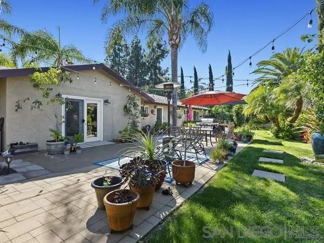 1528 Reche Road Fallbrook, CA 92028 - Photo 27 of 32 a view of a patio with chairs and potted plants