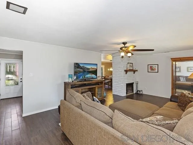1528 Reche Road Fallbrook, CA 92028 - Photo 4 of 32 a living room with furniture and a chandelier
