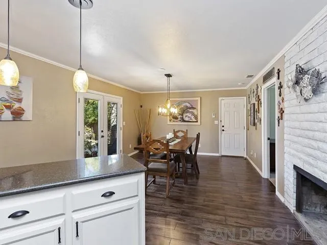 1528 Reche Road Fallbrook, CA 92028 - Photo 10 of 32 a view of a dining room with furniture window and wooden floor