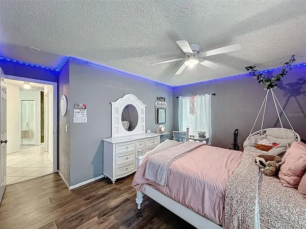 a bedroom with a bed and a desk