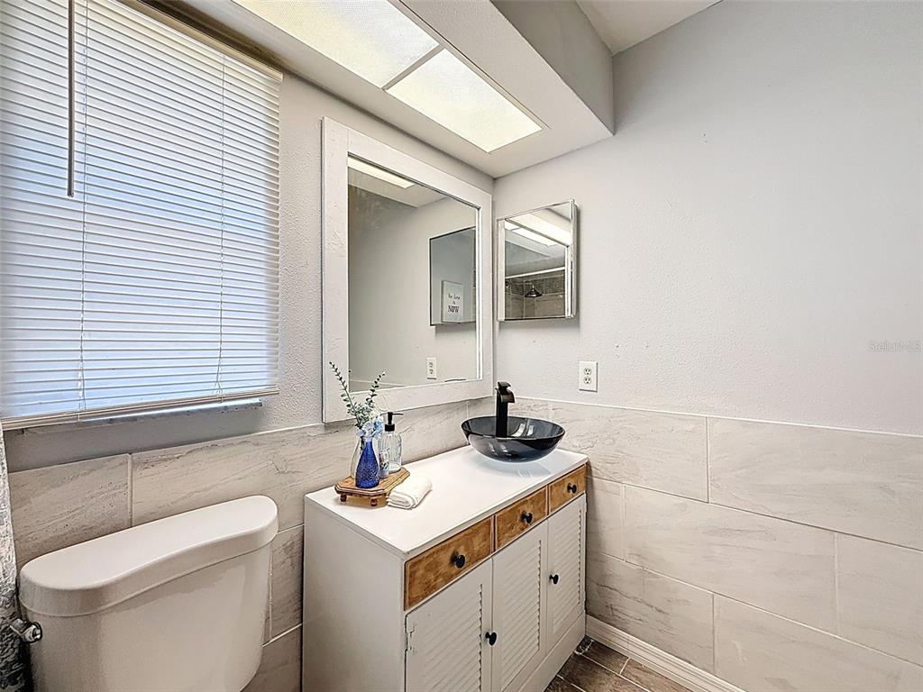 Undisclosed Address Spring Hill, FL 34608 - Photo 32 of 54 a bathroom with a sink and a toilet