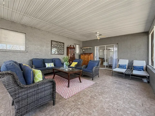 a view of swimming pool with outdoor seating