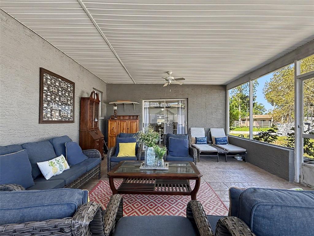 Undisclosed Address Spring Hill, FL 34608 - Photo 39 of 54 a living room with furniture and a large window
