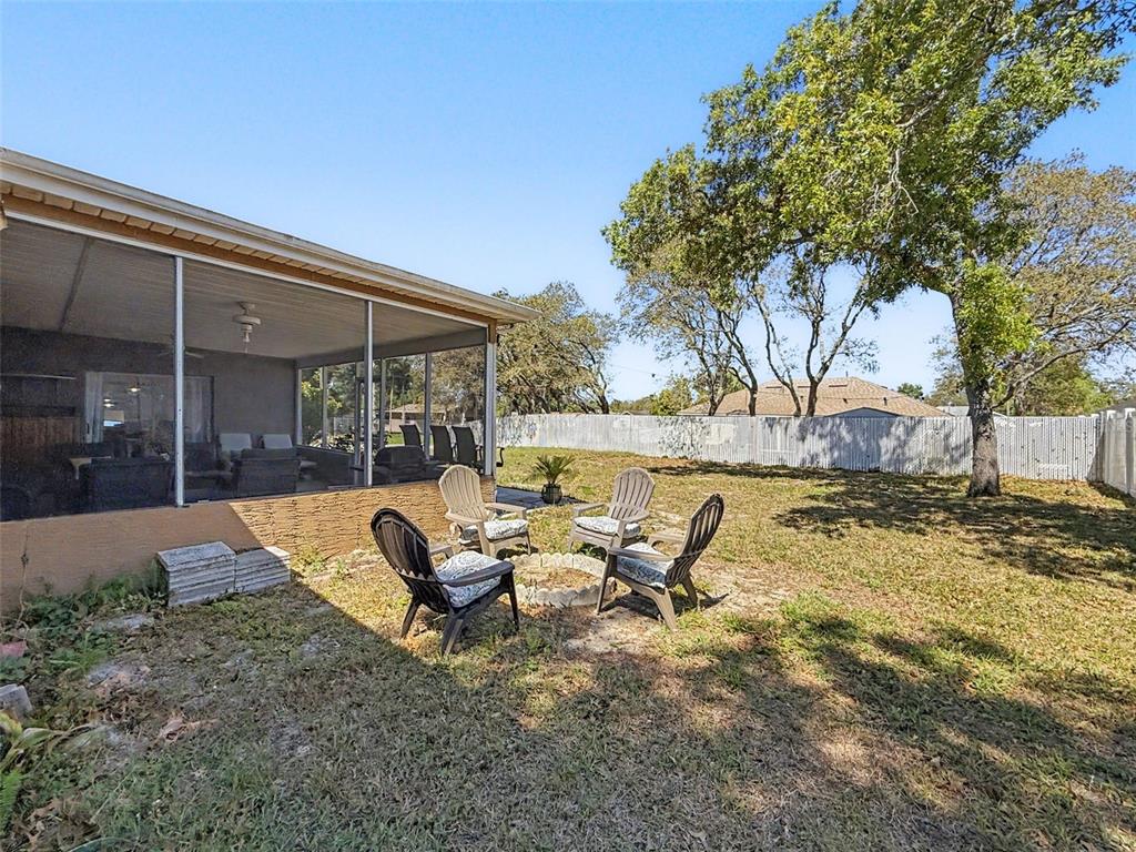Undisclosed Address Spring Hill, FL 34608 - Photo 40 of 54 a view of backyard with swimming pool and furniture