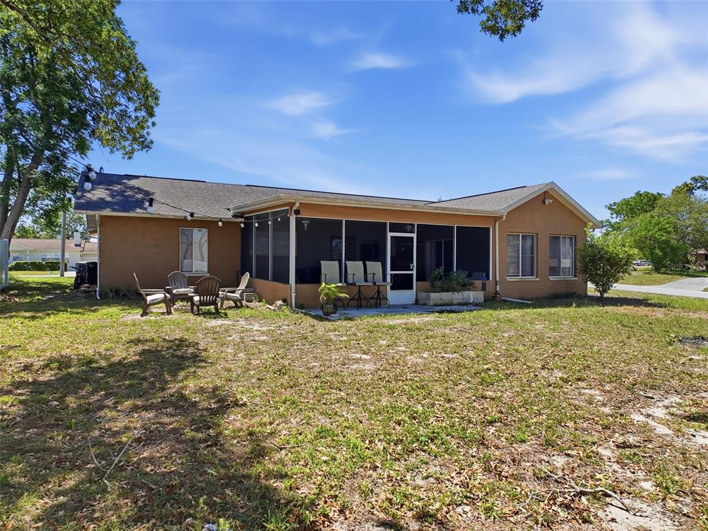 Undisclosed Address Spring Hill, FL 34608 - Photo 43 of 54 front view of a house with a yard