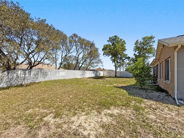 an aerial view of a house with swimming pool and ocean view