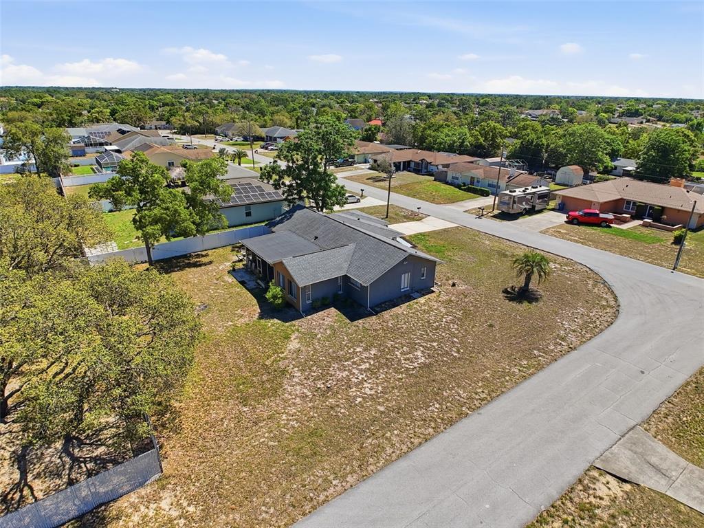 Undisclosed Address Spring Hill, FL 34608 - Photo 49 of 54 an aerial view of a house with a garden