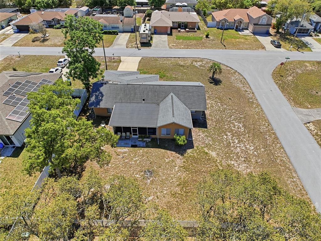 Undisclosed Address Spring Hill, FL 34608 - Photo 50 of 54 an aerial view of a house with swimming pool and ocean view