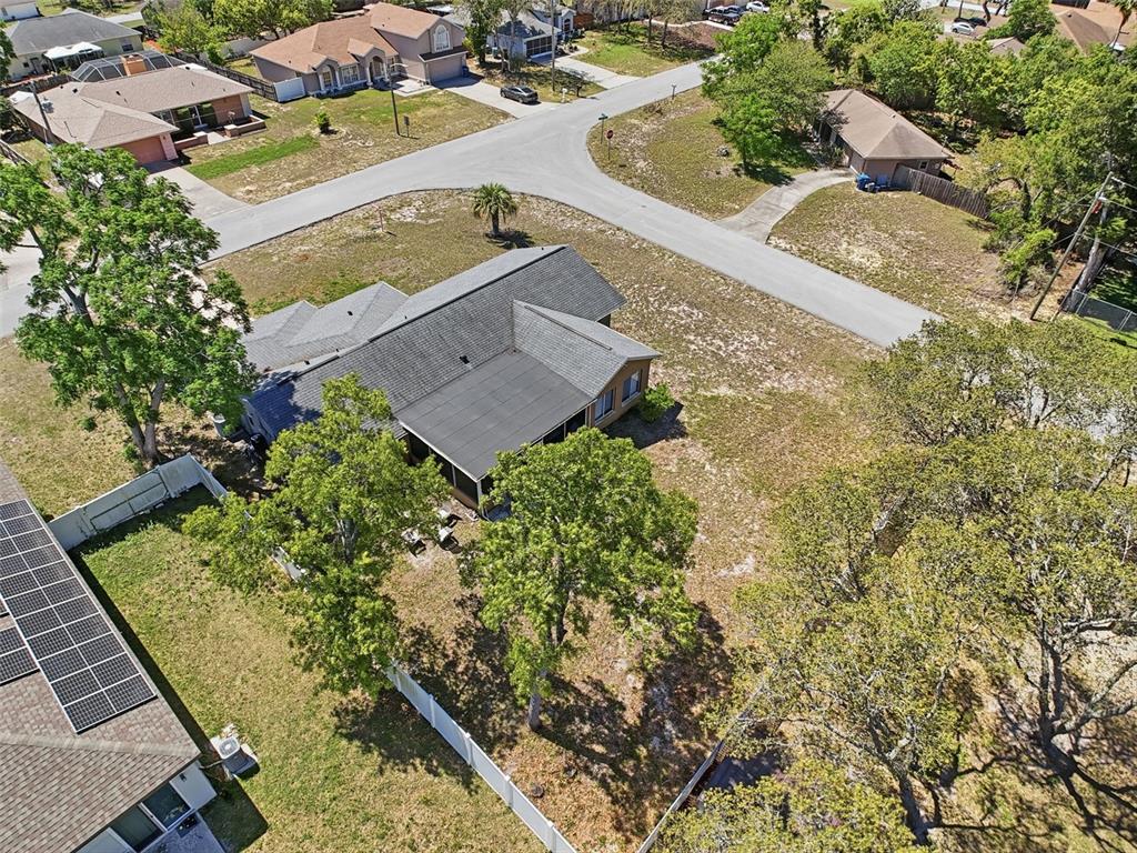 Undisclosed Address Spring Hill, FL 34608 - Photo 51 of 54 an aerial view of a house with a yard
