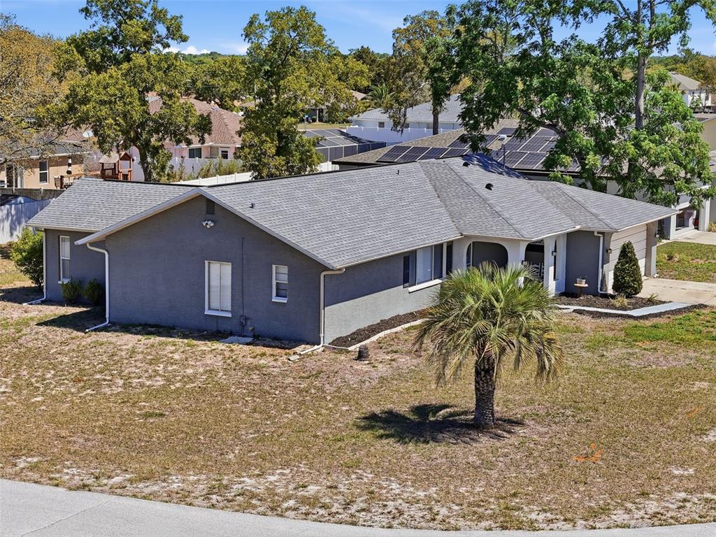 Undisclosed Address Spring Hill, FL 34608 - Photo 53 of 54 a house that has a tree in front of it