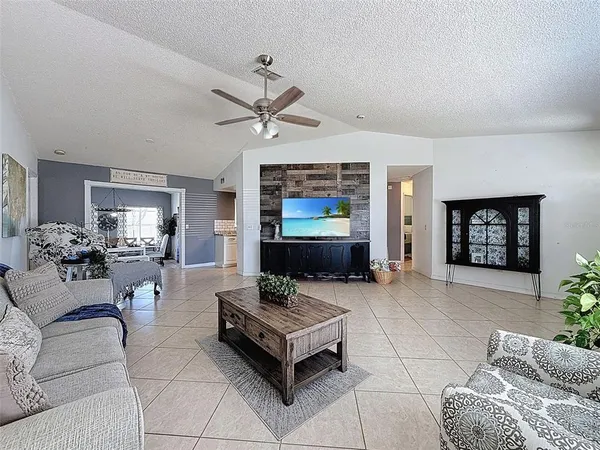 a kitchen with granite countertop a sink cabinets stainless steel appliances and a counter top space