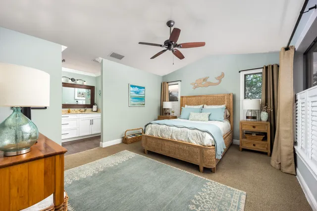 a bedroom with a bed a window and dresser