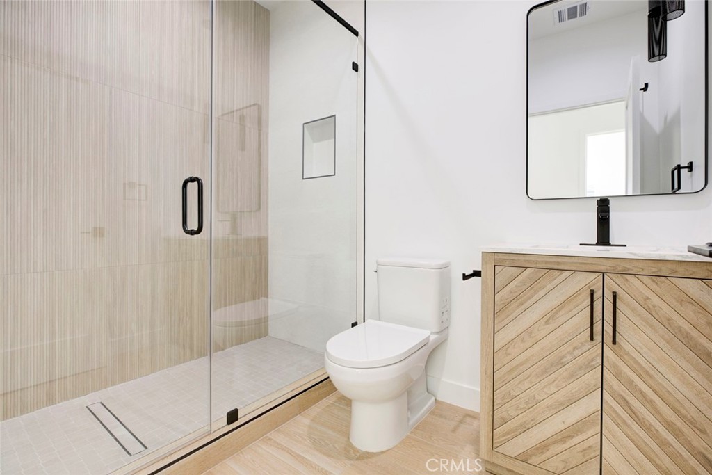 2242 North Keystone Street Burbank, CA 91504 - Photo 14 of 26 a bathroom with a sink toilet and shower