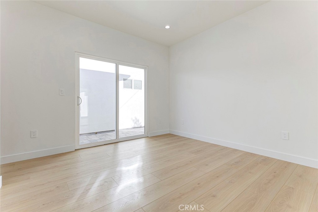 2242 North Keystone Street Burbank, CA 91504 - Photo 20 of 26 a view of an empty room with wooden floor and a window