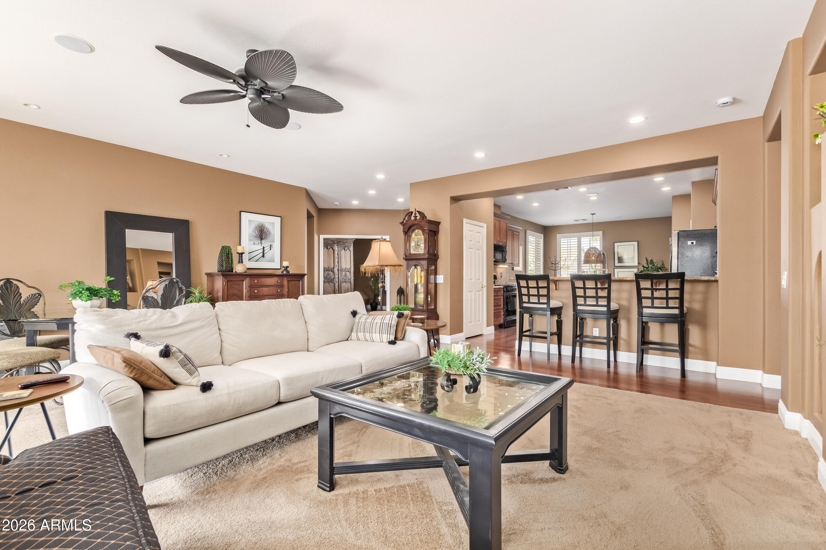 16287 West Cheery Lynn Road Goodyear, AZ 85395 - Photo 11 of 44 a living room with furniture and a view of kitchen