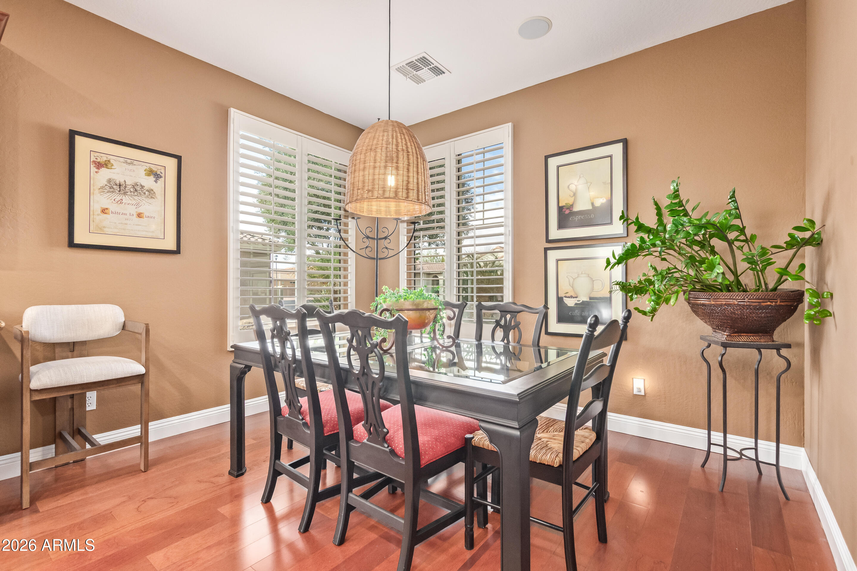 16287 West Cheery Lynn Road Goodyear, AZ 85395 - Photo 12 of 44 a view of a dining room with furniture window and wooden floor