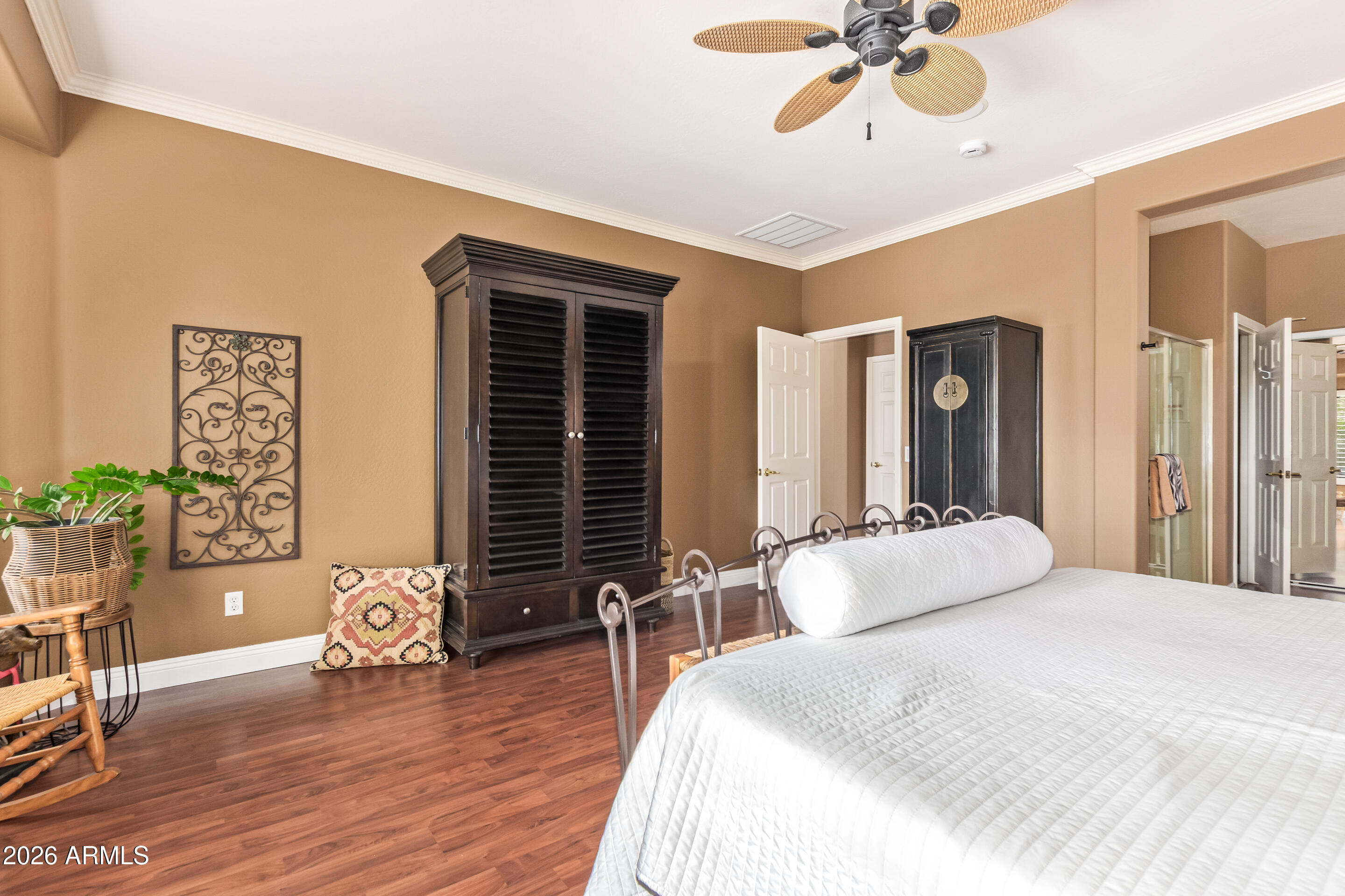 16287 West Cheery Lynn Road Goodyear, AZ 85395 - Photo 17 of 44 a bedroom with a bed a table and chair