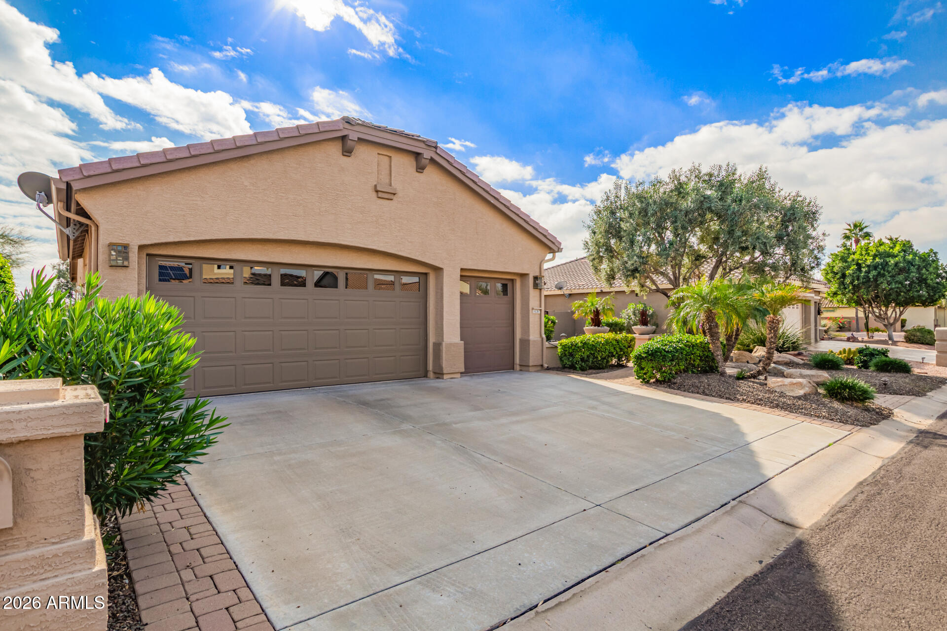 16287 West Cheery Lynn Road Goodyear, AZ 85395 - Photo 2 of 44 a front view of a house with a yard and garage
