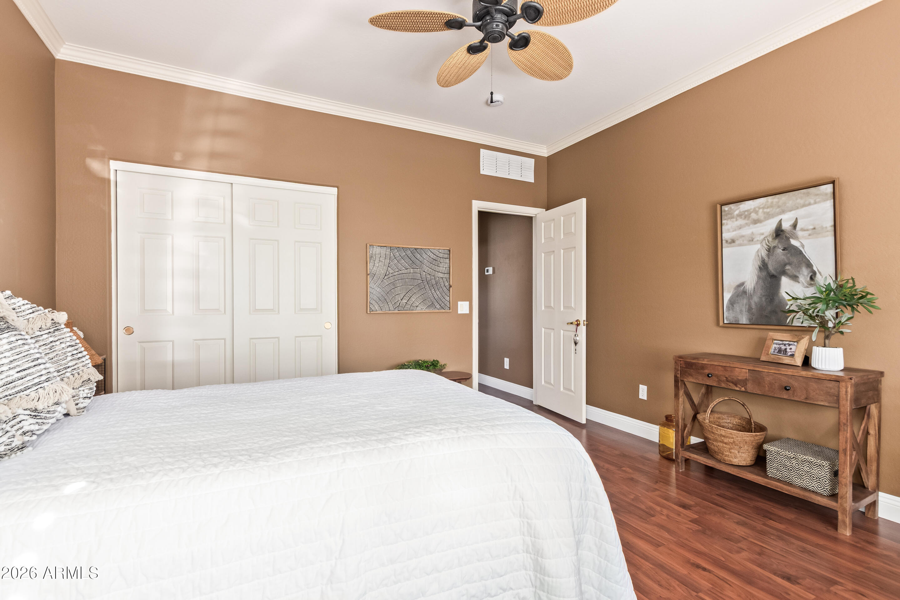 16287 West Cheery Lynn Road Goodyear, AZ 85395 - Photo 22 of 44 a bed room with a bed and a chandelier