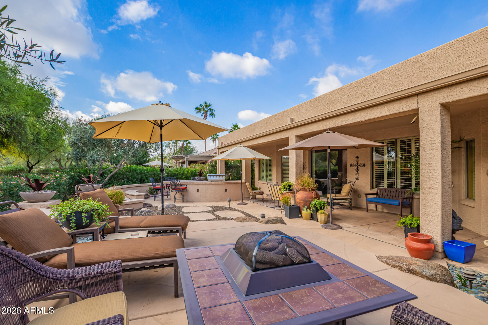 16287 West Cheery Lynn Road Goodyear, AZ 85395 - Photo 28 of 44 a view of a patio with chairs and tables