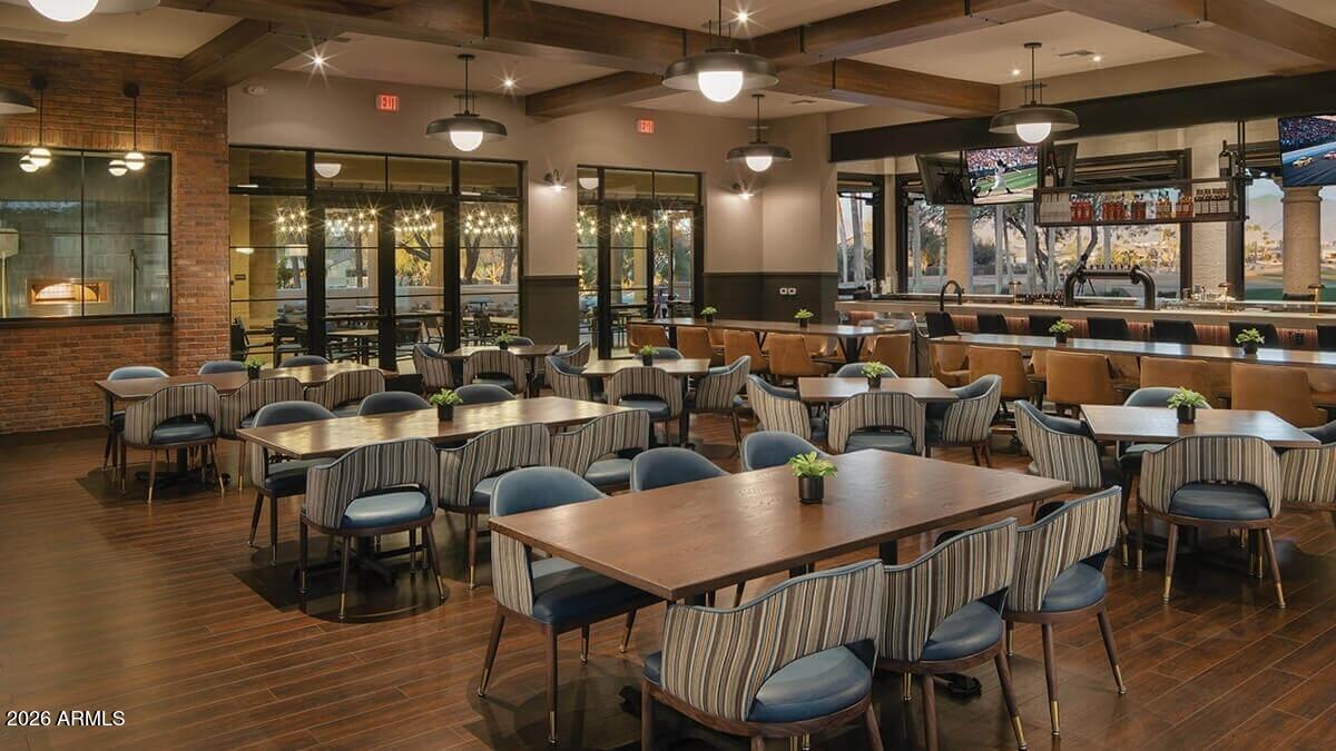 16287 West Cheery Lynn Road Goodyear, AZ 85395 - Photo 32 of 44 a view of a dining room with furniture and wooden floor