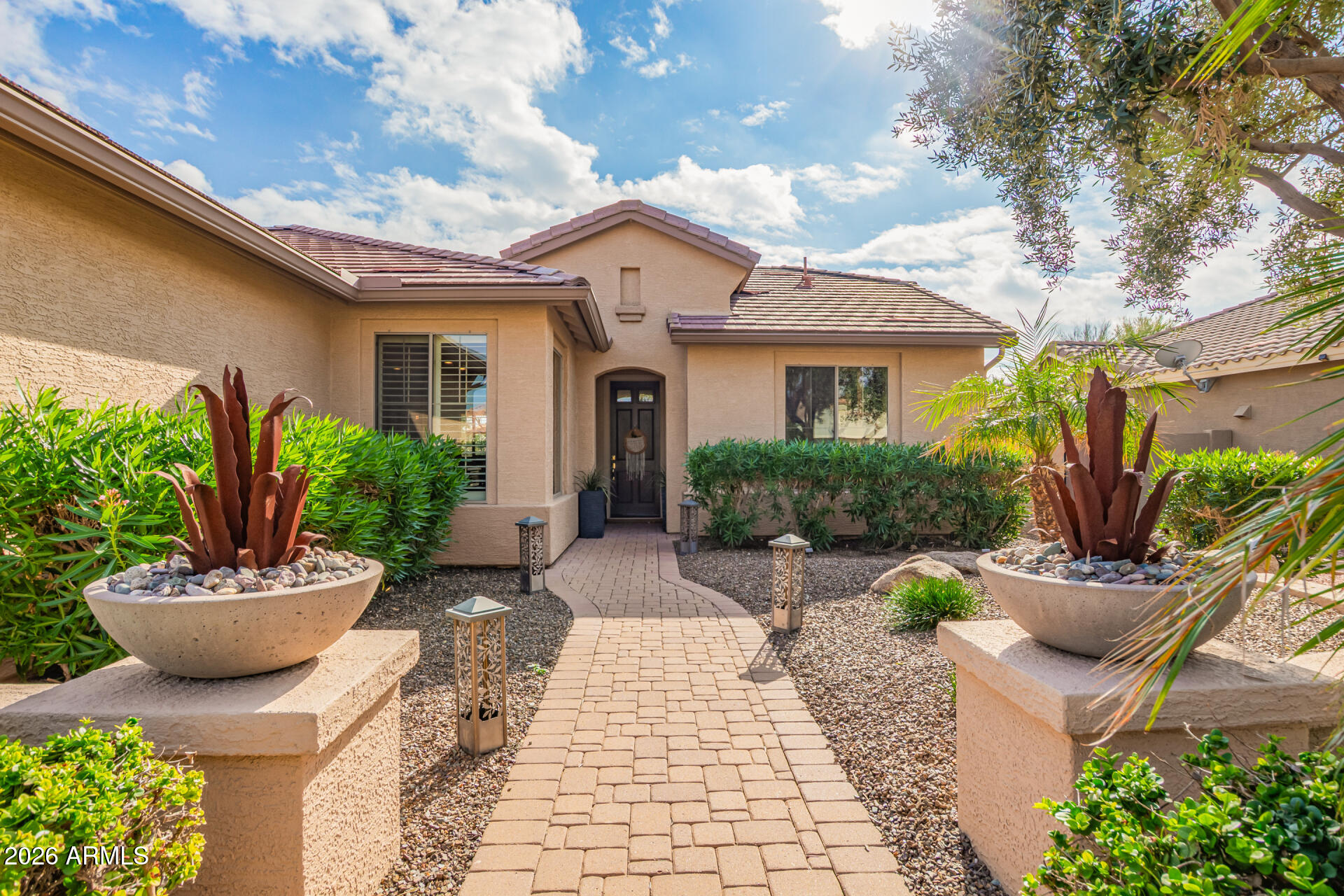 16287 West Cheery Lynn Road Goodyear, AZ 85395 - Photo 4 of 44 a view of a house with patio and a garden