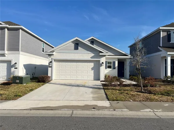 a front view of a house with yard