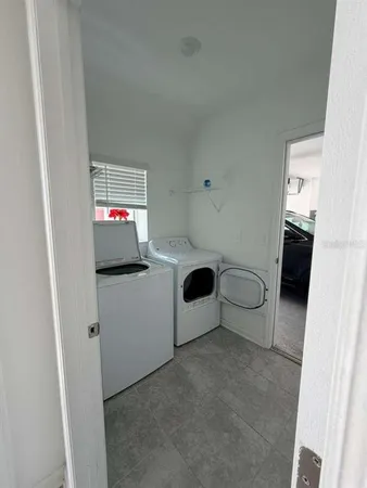 a view of a livingroom with a dinning table and chair