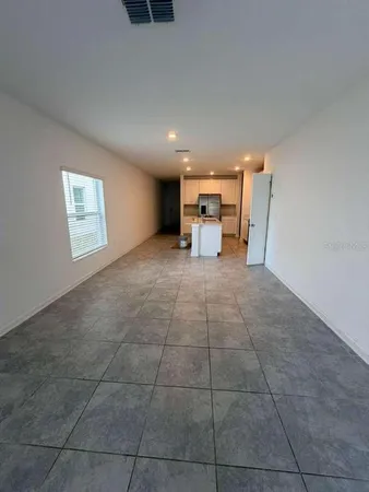 a bathroom with a granite countertop sink a large mirror and shower